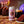 Load image into Gallery viewer, Yonder Double Choc Fudge Cake beer can with a chocolate cake, glass of dark beer, and candles on a wooden table.
